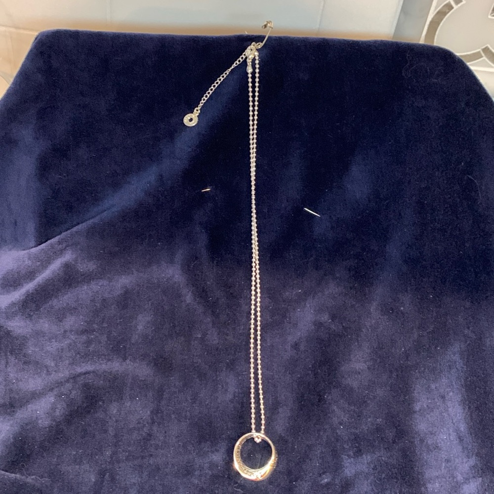 Equilibrium silver tone ball chain necklace. With charm.  Charm has text. NWT